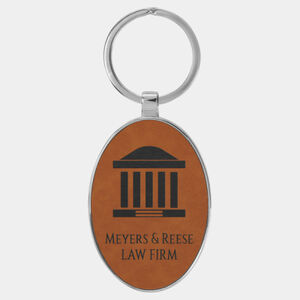 Personalized 3" x 1 3/4" Laserable Leatherette/Metal Rawhide Oval Keychain Thumbnail